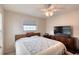 Comfortable bedroom with a ceiling fan, natural light, and wooden dresser for plenty of storage at 952 Northbrook Dr, Ormond Beach, FL 32174