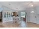 Bright dining area featuring tile flooring, a round table, and stylish decor at 952 Northbrook Dr, Ormond Beach, FL 32174