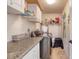 Efficient laundry room with modern appliances and ample counter space for folding and storage at 952 Northbrook Dr, Ormond Beach, FL 32174