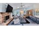 Spacious living room with a fireplace, large TV, and comfortable furniture for relaxing at 952 Northbrook Dr, Ormond Beach, FL 32174