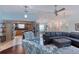 Open-concept living room featuring stylish furniture, tile floors, and a view of the kitchen at 952 Northbrook Dr, Ormond Beach, FL 32174
