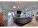 Bright and inviting living room with a brick fireplace and seamless access to the sunroom at 952 Northbrook Dr, Ormond Beach, FL 32174