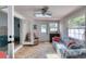Bright sunroom featuring tiled floors, a ceiling fan, and comfortable seating with a view to the outdoors at 952 Northbrook Dr, Ormond Beach, FL 32174