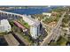 This aerial view showcases the condo's exterior, parking, water views, and bridge proximity at 100 Silver Beach Ave # 608, Daytona Beach, FL 32118