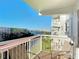 This balcony has seating and views of the water and a bridge at 100 Silver Beach Ave # 608, Daytona Beach, FL 32118