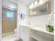 Updated bathroom with a glass shower, sink, and vanity at 100 Silver Beach Ave # 608, Daytona Beach, FL 32118