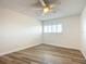 Bedroom featuring a ceiling fan, wood flooring, and a window at 100 Silver Beach Ave # 608, Daytona Beach, FL 32118