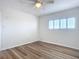 This bedroom features modern wood floors and a bright window at 100 Silver Beach Ave # 608, Daytona Beach, FL 32118