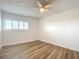 Bedroom featuring a ceiling fan, wood flooring, and a window at 100 Silver Beach Ave # 608, Daytona Beach, FL 32118