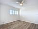 This bedroom features modern wood floors and a bright window at 100 Silver Beach Ave # 608, Daytona Beach, FL 32118