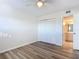 This bedroom features modern wood floors, a ceiling fan, and a closet at 100 Silver Beach Ave # 608, Daytona Beach, FL 32118
