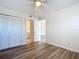 This bedroom features modern wood floors and a ceiling fan at 100 Silver Beach Ave # 608, Daytona Beach, FL 32118