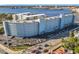 An aerial view of a condominium complex near the water with parking and bridge access at 100 Silver Beach Ave # 608, Daytona Beach, FL 32118