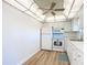 Bright kitchen featuring white appliances, cabinets, countertops, and a ceiling fan with unique lighting at 100 Silver Beach Ave # 608, Daytona Beach, FL 32118
