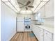 Bright kitchen with white appliances, cabinets, and countertops at 100 Silver Beach Ave # 608, Daytona Beach, FL 32118