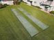 Overhead view of well-maintained shuffleboard courts in a grassy area near a condo at 100 Silver Beach Ave # 608, Daytona Beach, FL 32118