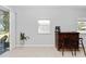 Bright bar area with a bar, stools, and sliding glass doors for natural light at 1005 Flagler Ave, Edgewater, FL 32132