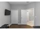Cozy bedroom featuring hardwood floors, a TV, and closet space at 1005 Flagler Ave, Edgewater, FL 32132