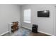 Bedroom with a built-in desk, natural light, and a TV at 1005 Flagler Ave, Edgewater, FL 32132