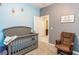 Bright Bedroom features a crib, rocking chair, and neutral decor at 1005 Flagler Ave, Edgewater, FL 32132