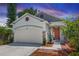 Charming single-Gathering home with a two car garage, brick accents, and manicured landscaping at 1005 Flagler Ave, Edgewater, FL 32132