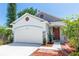 Charming single-Gathering home with a two car garage, brick accents, and manicured landscaping at 1005 Flagler Ave, Edgewater, FL 32132