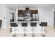 Well-lit kitchen featuring granite countertops, dark cabinetry, and stainless steel appliances at 1005 Flagler Ave, Edgewater, FL 32132