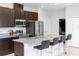 Modern kitchen featuring granite countertops, stainless steel appliances, and bar seating at 1005 Flagler Ave, Edgewater, FL 32132