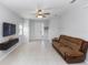 Bright living room featuring neutral walls, tile floors, and modern furnishings at 1005 Flagler Ave, Edgewater, FL 32132