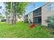 A well-maintained condo building with a spacious lawn and screened lanais at 102 Bob White Ct # 102C, Daytona Beach, FL 32119