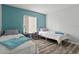Shared bedroom featuring two twin beds with coordinated decor and wood look floors at 102 Bob White Ct # 102C, Daytona Beach, FL 32119