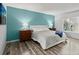 Comfortable bedroom with ample natural light and wood floors, a peaceful retreat at 102 Bob White Ct # 102C, Daytona Beach, FL 32119