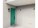 Exterior view of a charming condo entrance with a teal front door and unit numbers at 102 Bob White Ct # 102C, Daytona Beach, FL 32119