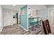 Bright kitchen with breakfast bar, bar stool seating, and stainless steel appliances providing a functional and social cooking space at 102 Bob White Ct # 102C, Daytona Beach, FL 32119