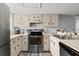 Functional kitchen with stainless steel appliances, ample counter space, and classic cabinetry providing a cozy cooking area at 102 Bob White Ct # 102C, Daytona Beach, FL 32119