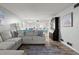 Bright living room with an open floor plan and hardwood floors, creating an inviting space at 102 Bob White Ct # 102C, Daytona Beach, FL 32119
