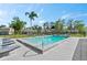 Beautiful community pool surrounded by lounge chairs and lush landscaping at 102 Bob White Ct # 102C, Daytona Beach, FL 32119