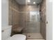 Walk-in shower with tile surround, bench and grab bars for accessibility at 102 Bob White Ct # 102C, Daytona Beach, FL 32119
