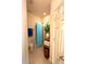 Cozy bathroom featuring tiled floors, a toilet, shower, linen storage, and a plant at 103 Manor View Ln, Deland, FL 32724
