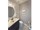 This bathroom features gray walls, a modern sink, and a framed art piece at 103 Manor View Ln, Deland, FL 32724