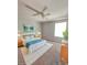 This bedroom boasts neutral walls, ceiling fan, and a plush bed and carpet at 103 Manor View Ln, Deland, FL 32724