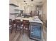 Modern kitchen with gray cabinets, quartz countertops, stainless steel appliances, and a wine fridge at 103 Manor View Ln, Deland, FL 32724