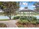Scenic gazebo by the lake, offering a serene retreat with beautiful waterfront views and seating at 103 Manor View Ln, Deland, FL 32724