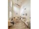 Bright living room with high ceilings, wood-look tile flooring, and neutral decor at 103 Manor View Ln, Deland, FL 32724