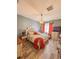 Inviting main bedroom featuring a plush bed, hardwood floors, and soft, natural light at 103 Manor View Ln, Deland, FL 32724