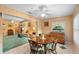 Charming dining area showcases an adjacent sunroom, creating an ideal spot for Gathering meals with easy access to the living room at 1057 Shady Hollow Dr, Deland, FL 32724
