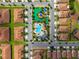 Aerial view of a community featuring a pool, recreation area, and well-maintained landscaping at 1079 Quaker Ridge Ln, Davenport, FL 33896