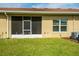 Screened lanai with green grass and backyard at 1079 Quaker Ridge Ln, Davenport, FL 33896
