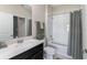 Bright bathroom featuring a shower/tub combination, quartz countertops, and stylish accents at 1079 Quaker Ridge Ln, Davenport, FL 33896