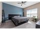 Spacious bedroom with a large bed and a serene atmosphere at 1079 Quaker Ridge Ln, Davenport, FL 33896